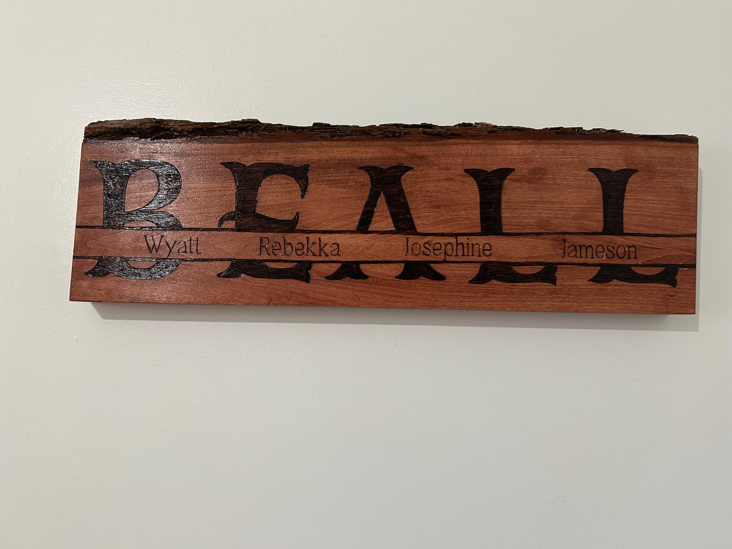 Personalized Wood-Burned Family Name Sign – Handmade Live Edge Basswood – Custom Last Name & Members – Rustic Home Decor