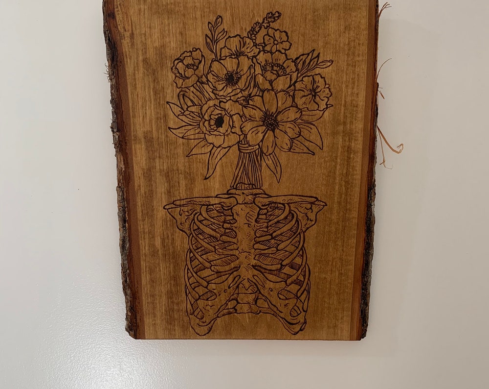 Skeleton Ribcage floral head woodburning art
